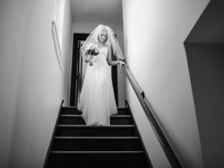 Elgin Getting Ready Photos by Illinois Wedding Photographer Bride walking down the stairs