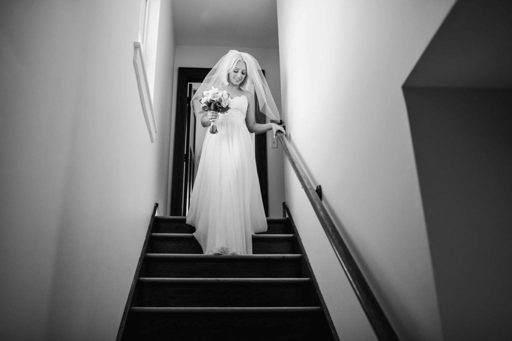 Elgin Getting Ready Photos by Illinois Wedding Photographer Bride walking down the stairs