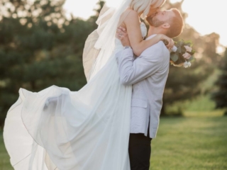 groom lifting his bride golden hour photography