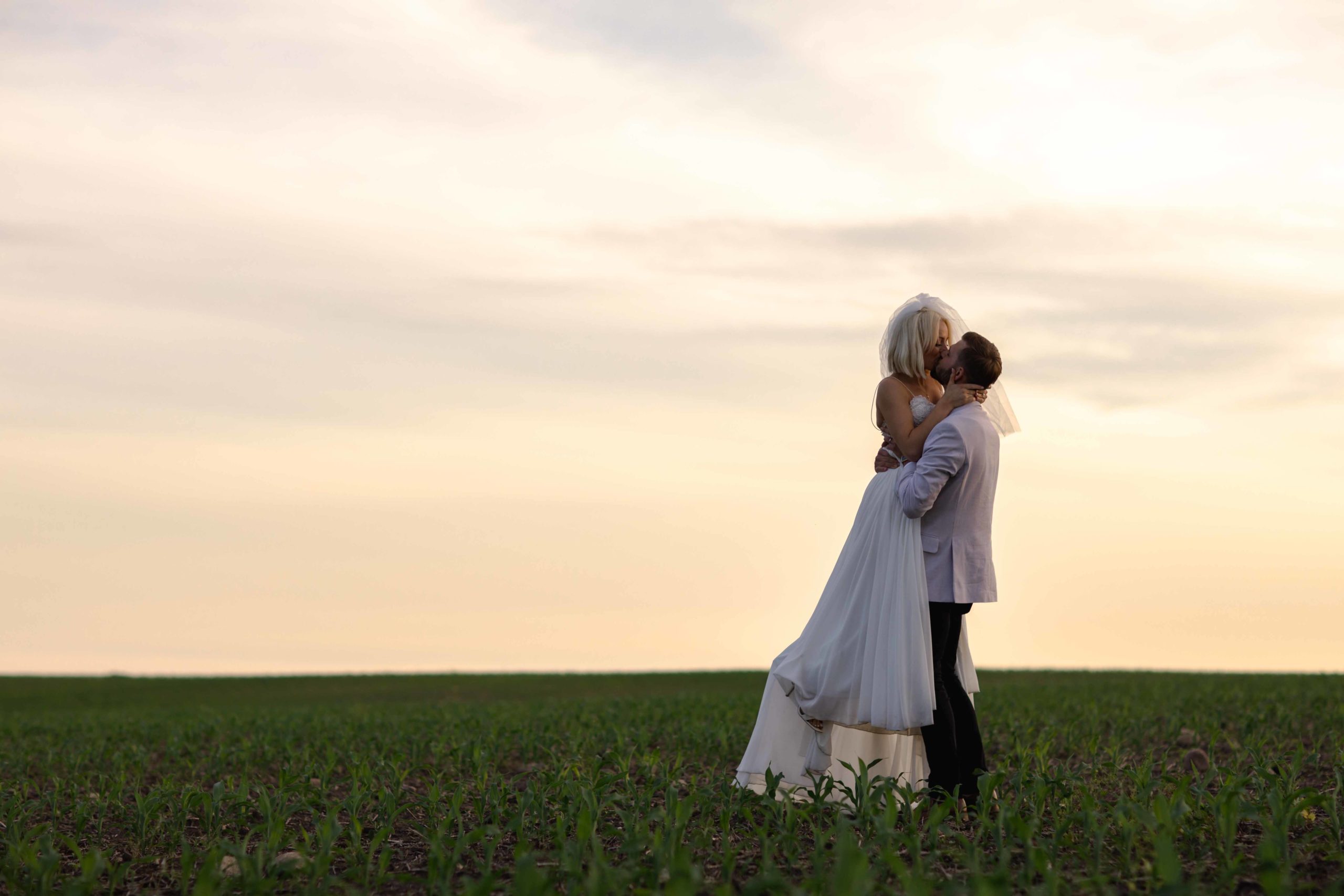 sunset in field in Illinois by Geneva Wedding Photographer