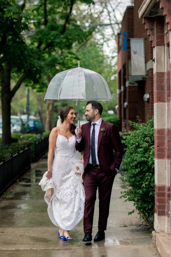 Chicago Illinois Wedding Photography Bride and Groom in the rain with clear umbrella