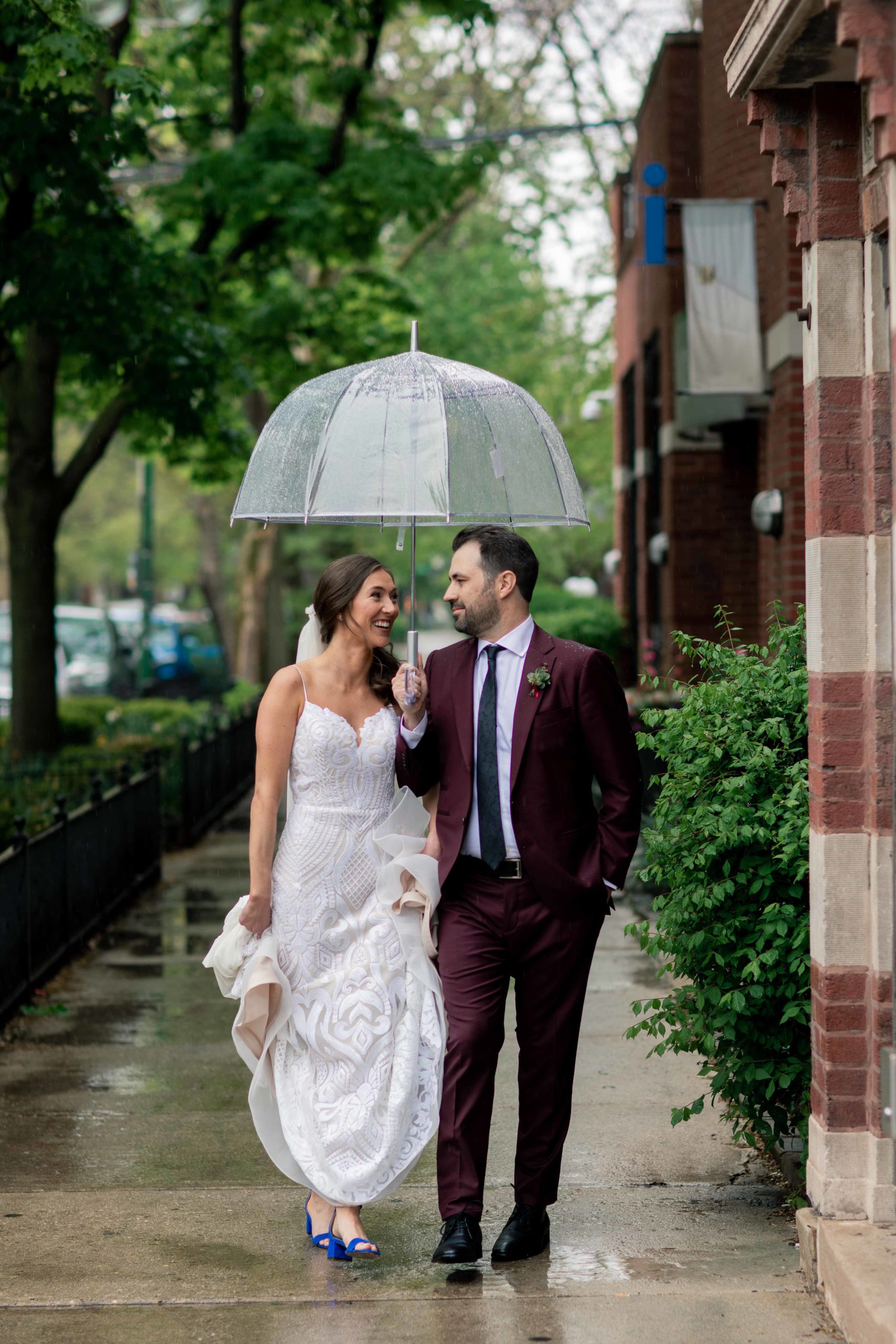 Chicago Illinois Wedding Photography Bride and Groom in the rain with clear umbrella