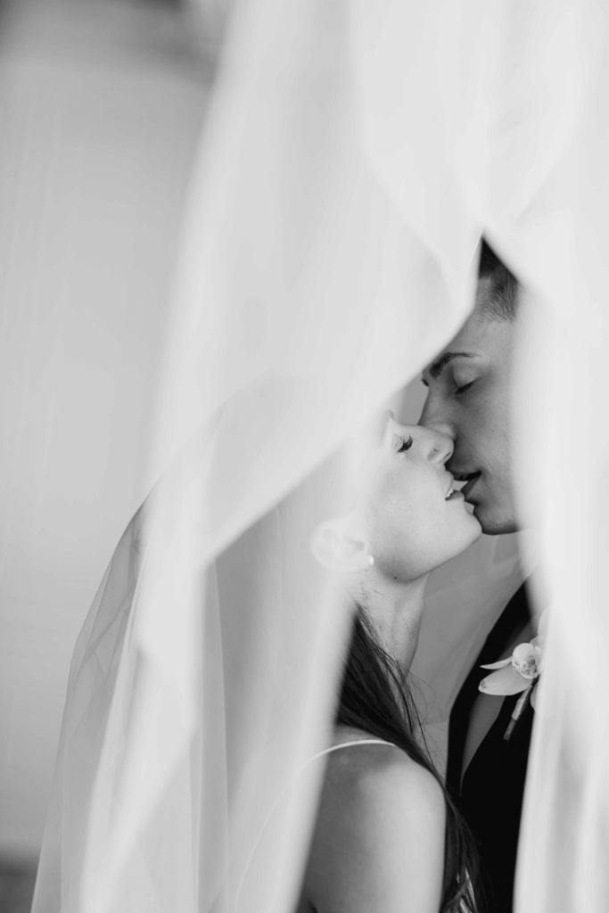 Company 251 Geneva Wedding Photographer bride and groom almost kiss under the veil in black and white