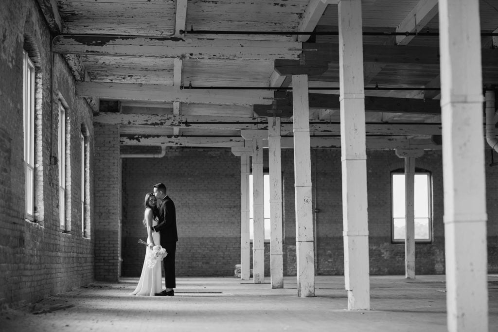 Company 251 Geneva Wedding Photographer bride and groom in empty warehouse black and white