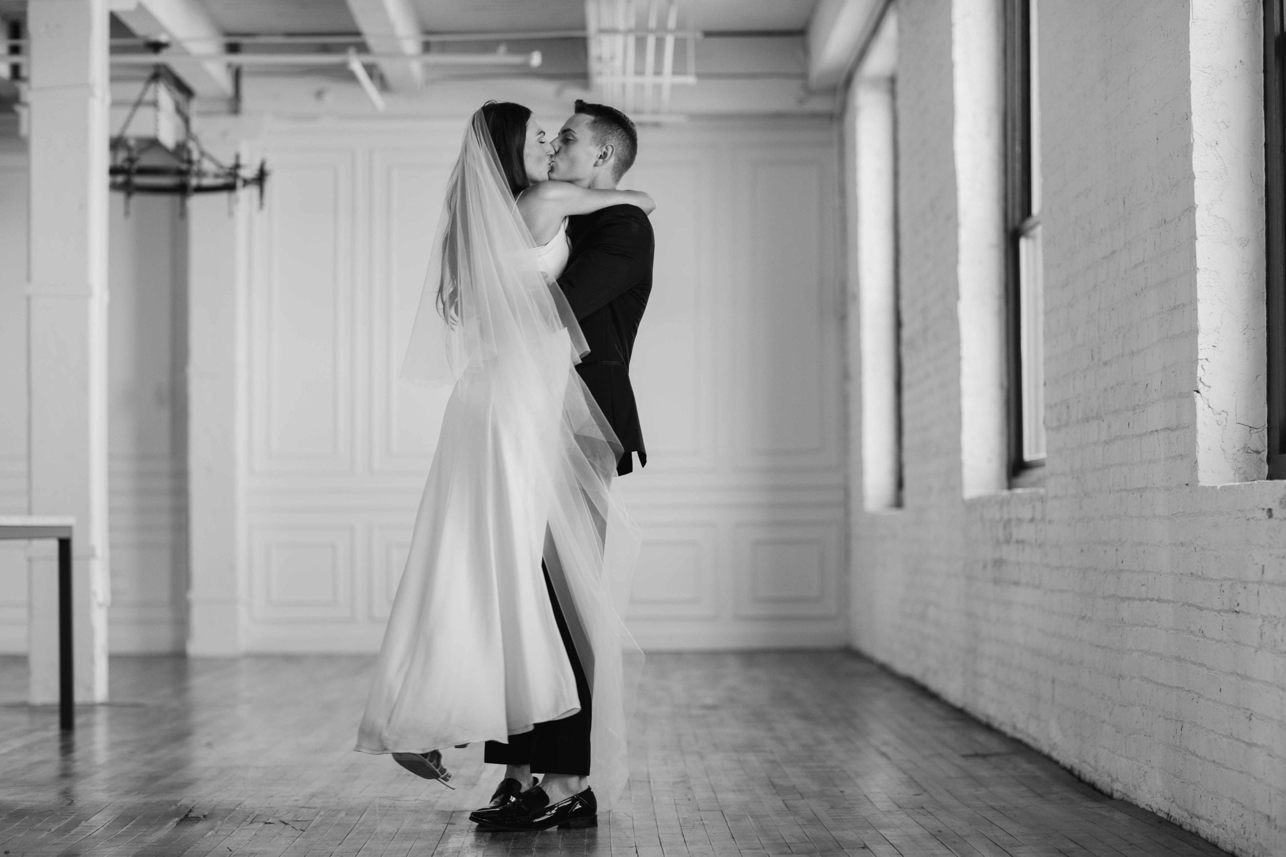 Company 251 Geneva Wedding Photographer bride and groom spinning in black and white