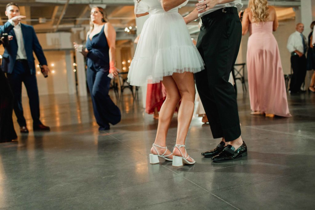 Company 251 Geneva Wedding Photographer bride and groom wedding shoes dancing at reception