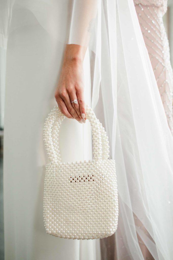 Company 251 Geneva Wedding Photographer bride with pearl purse