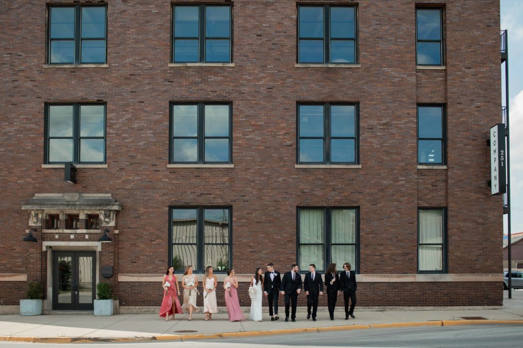 Company 251 bridal party portrait in front of building Geneva Wedding Photographer