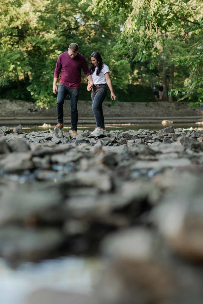 Naperville Riverwalk Engagement Photography in the river by Illinois Photographer
