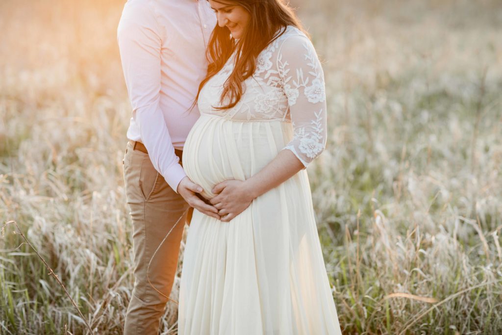 Outdoor Golden Hour Geneva Illinois Maternity Photoshoot couple in a field