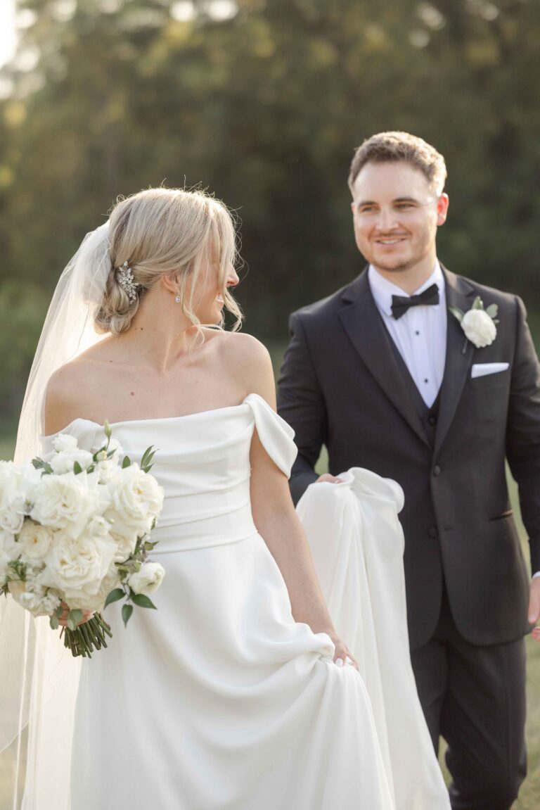 Groom Holding Dress Soft Bright The Pavillion at Orchard Ridge Farms Summer Fall September Wedding By Mary Rose Photography-68