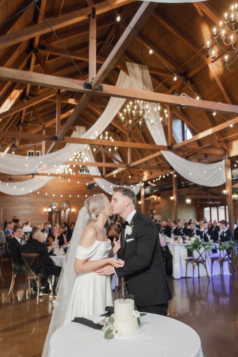 Soft Bright Kissing at Cake The Pavillion at Orchard Ridge Farms Summer Fall September Wedding By Mary Rose Photography-85